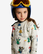 Load image into Gallery viewer, Little girl wearing white jumper with various prints of kids skiing. Comes with ribbed cuffs and brushed cotton from the inside for extra warmth. Made by Nadadelazos

