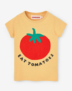 Yellow t-shirt with a big tomato print at the front. The phrase "EAT TOMATOES" is written in capital letters under the tomato print. Made by Nadadelazos