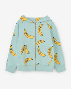 Turquoise hoodie with a yellow bananas all-over print. The hoodie has a bronze zipper opening on the front and ribbed cuffs. Made by Nadadelazos