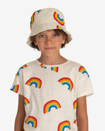 Load image into Gallery viewer, Model wearing Off-white sun hat with rainbow all-over print. Made by Nadadelazos
