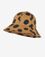 Load image into Gallery viewer, Brown hat with a large black polka dots all-over print. Made by Nadadelazos

